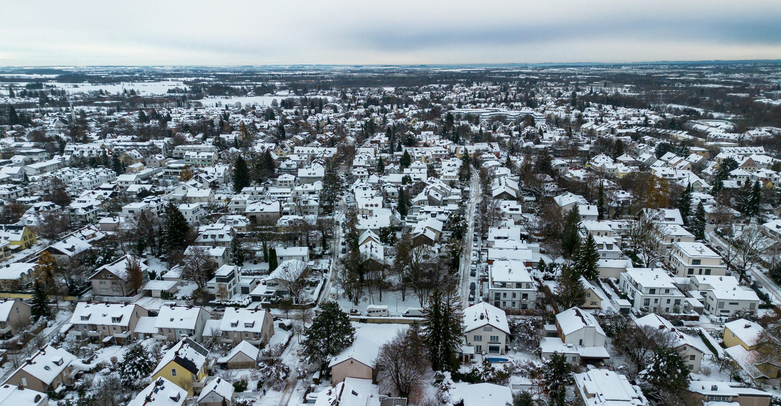 Dense urban neighbourhood blanketed in snow.
