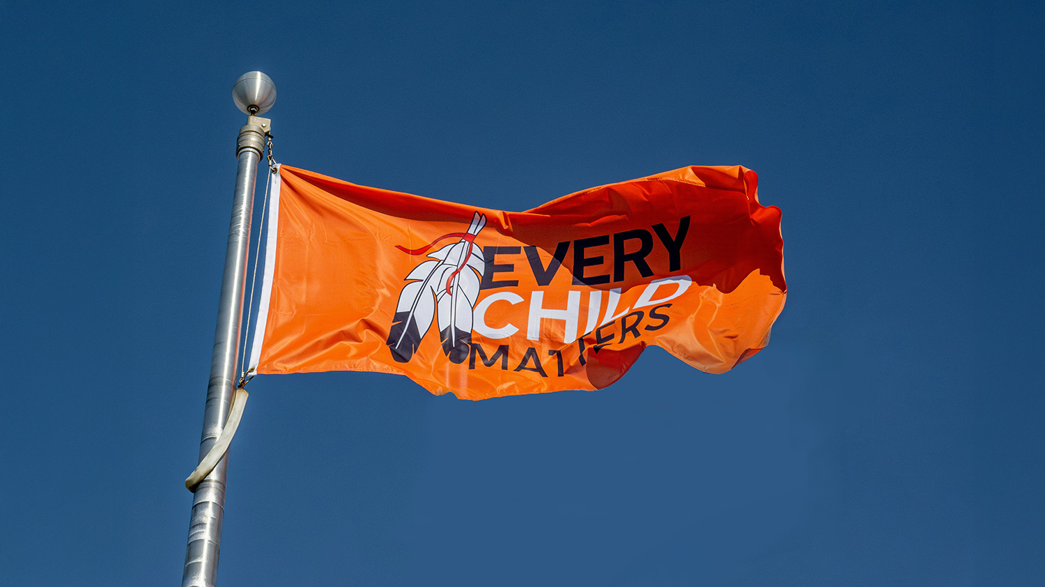 Orange flag with the words 