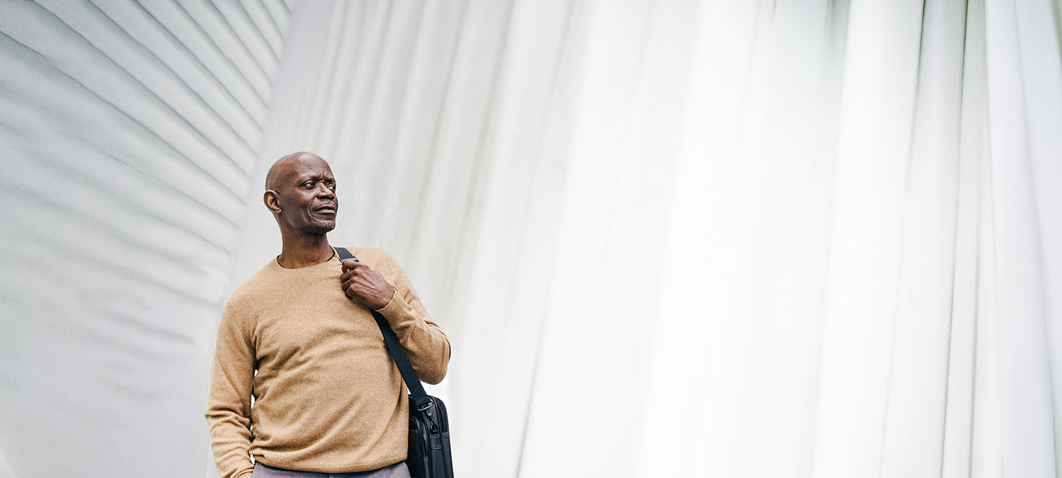 Black man commuting to work downtown