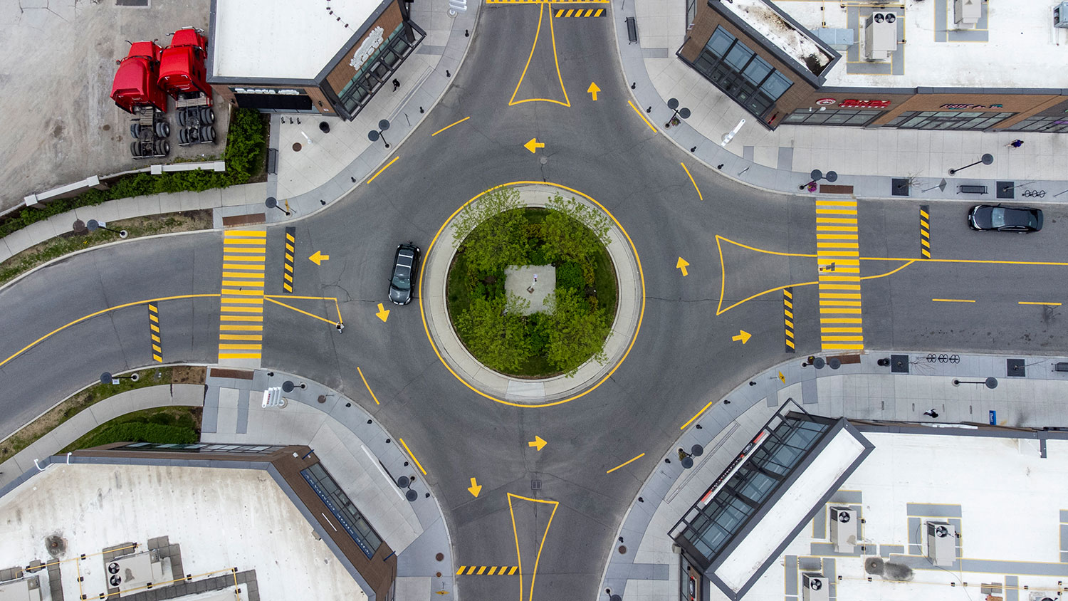 Aerial shot of a roundabout intersection at St. Clair West and Weston Road