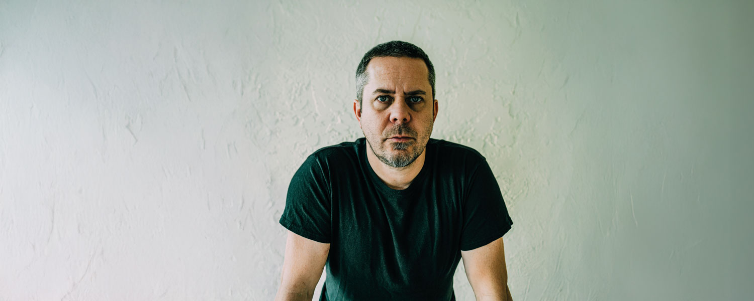 A middle-aged man with a serious face